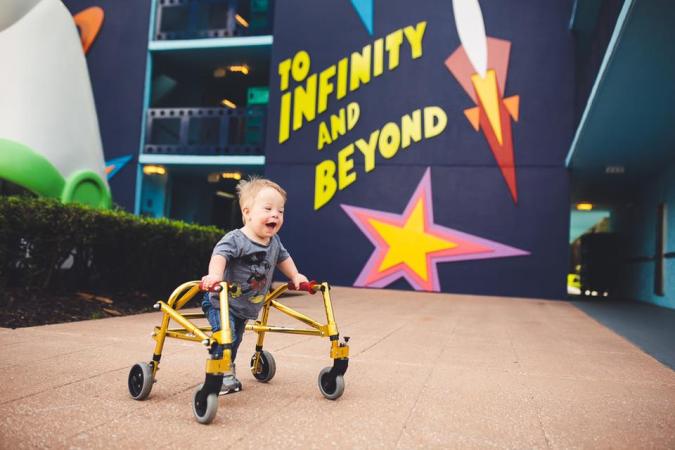 toddler with Down syndrome and his walker